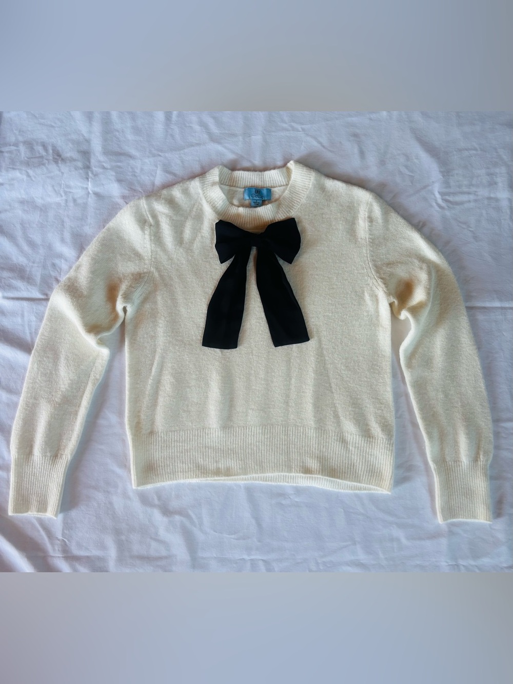 CeCe Cream Sweater with Black Bow Accent
